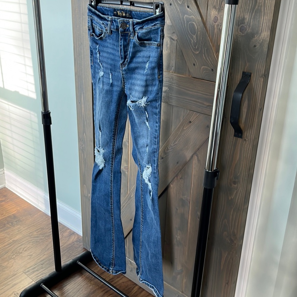 Indigo rein flared jeans with rips.